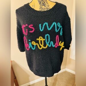 BiBi Black Sweater with Pink, Blue, and Yellow Text